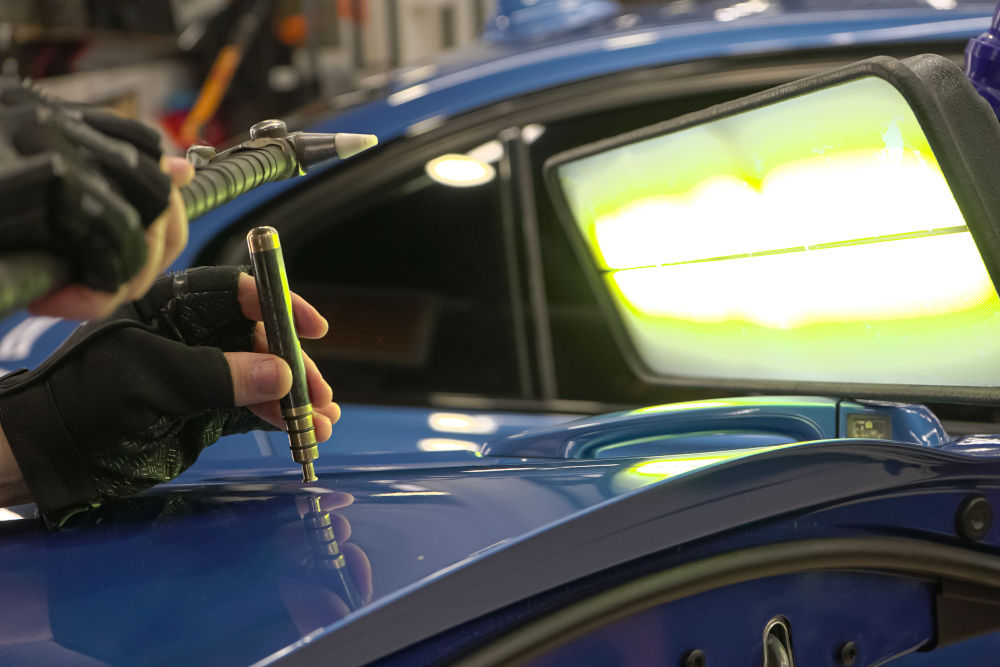 Hail damage repair on a vehicle